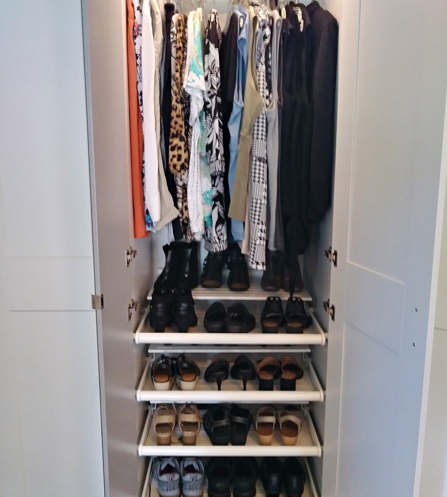 Custom closet with folded clothing shelves and hanging space