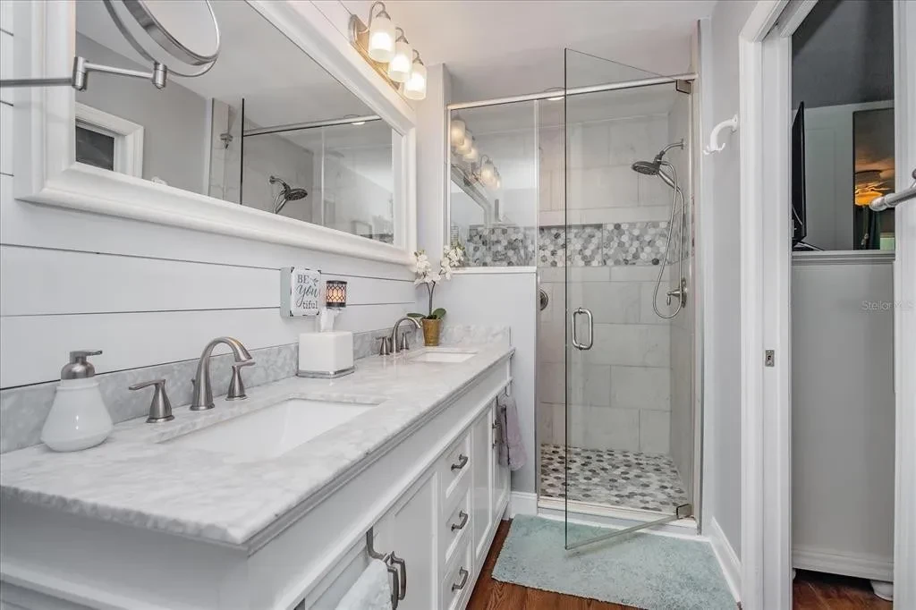 Primary bathroom with refreshed vanity and bright finishes