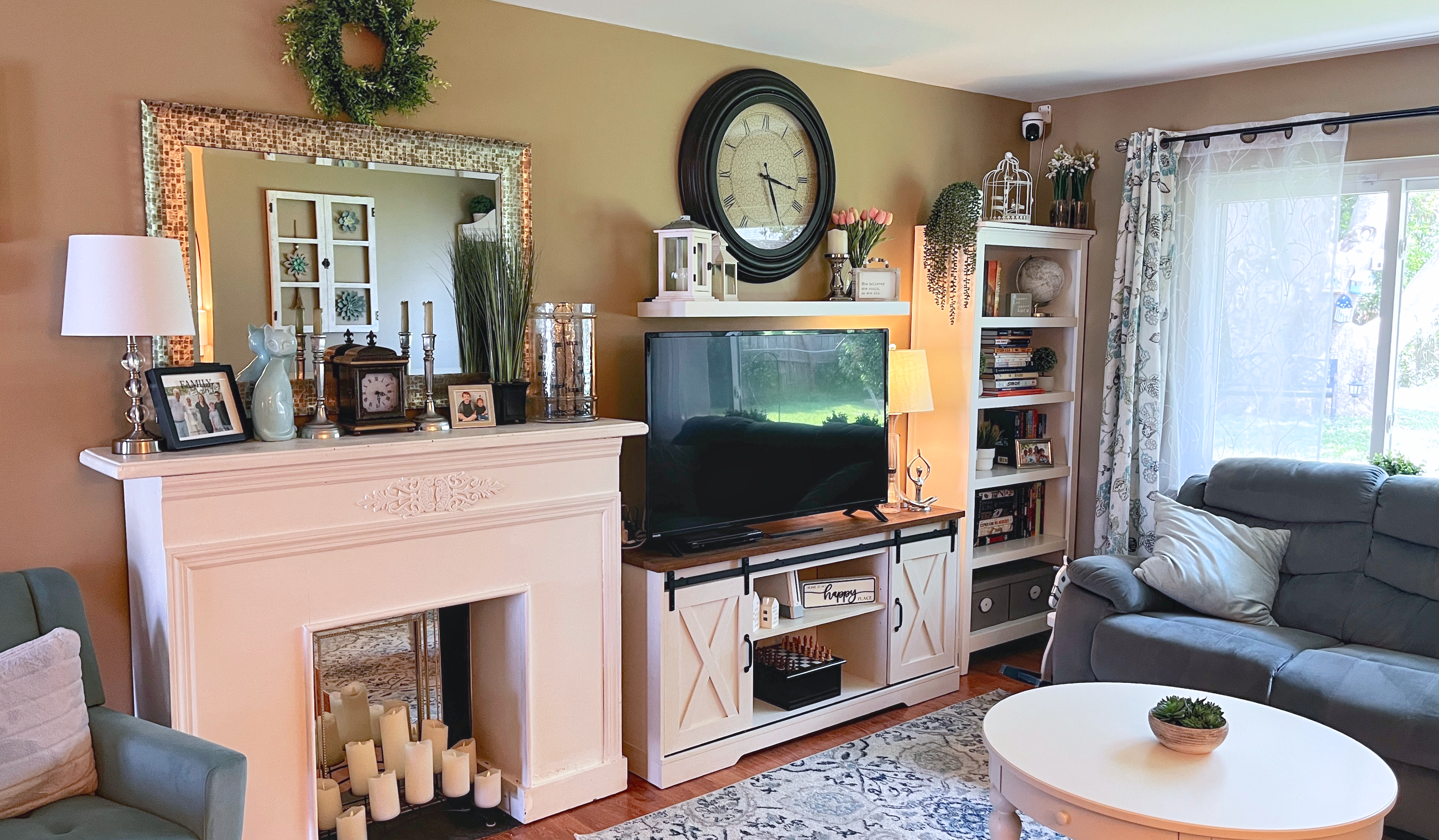 Living room with a white fireplace, media console, and coordinated seating