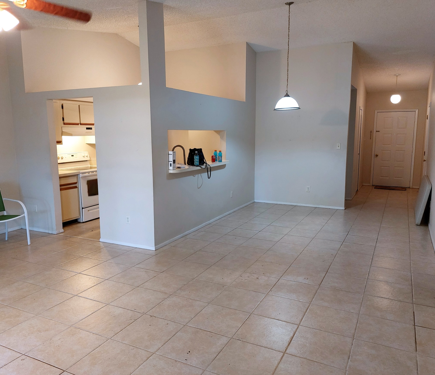 Dining area before refresh with darker finishes and less defined styling