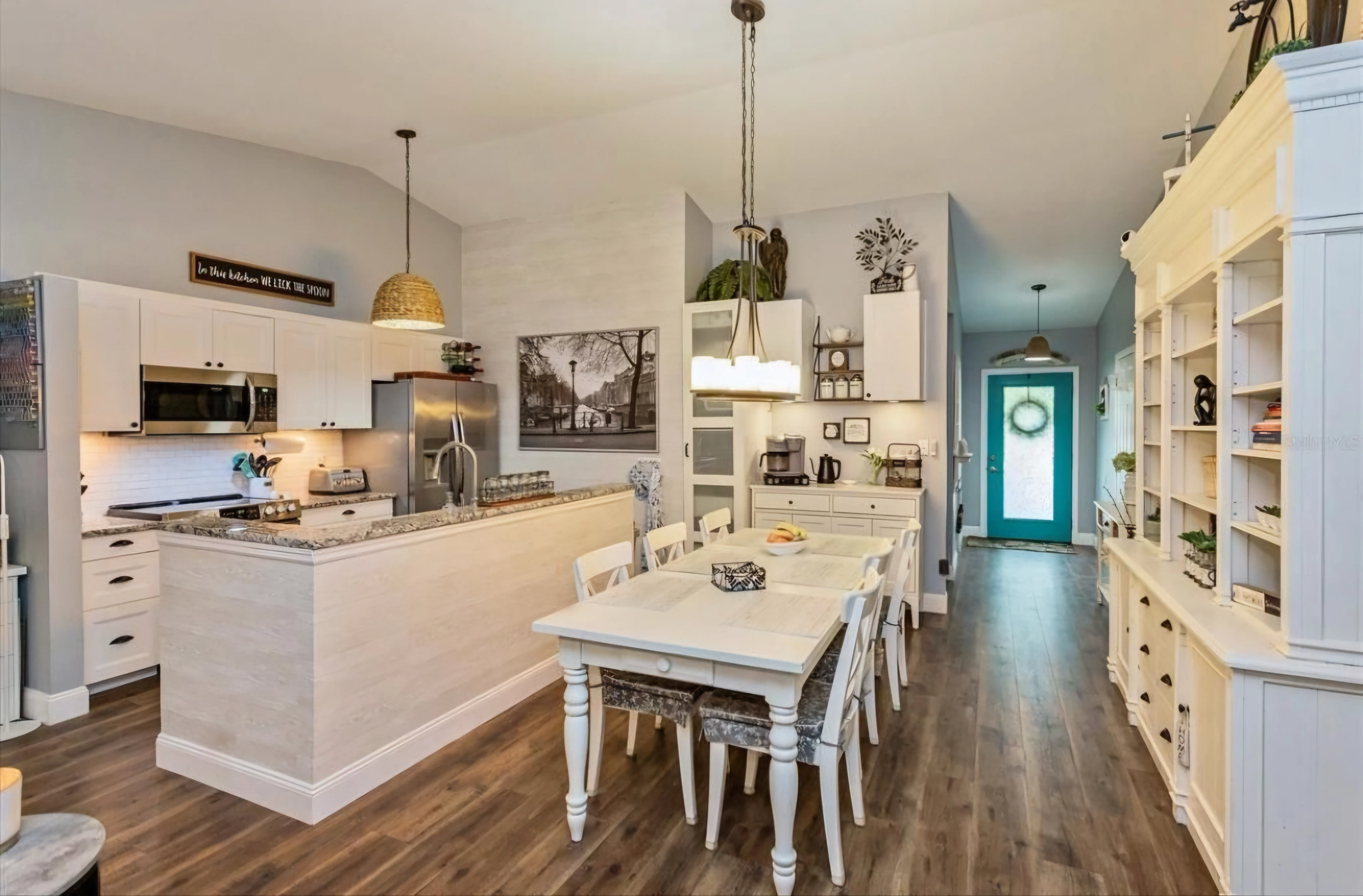 Dining area styled with warm flooring and simple finishes