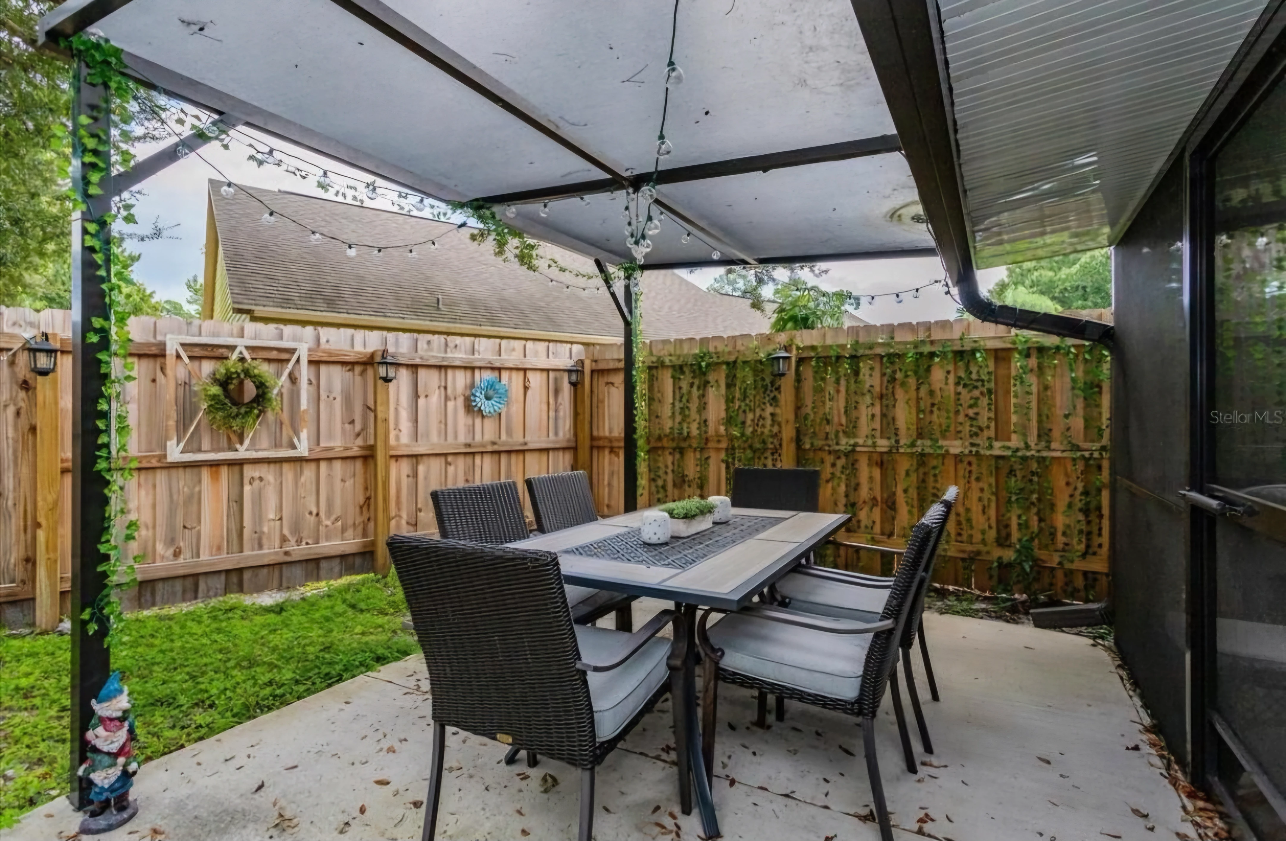 Second patio angle with outdoor seating and plants
